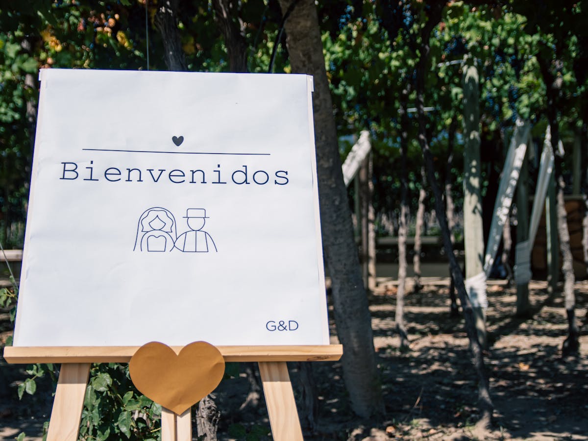 Welcome sign on an easel with florals