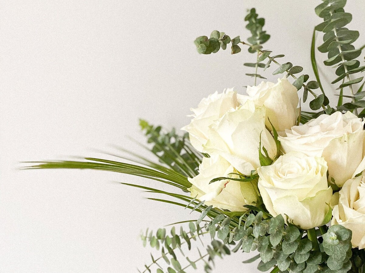 White roses and eucalyptus arrangement